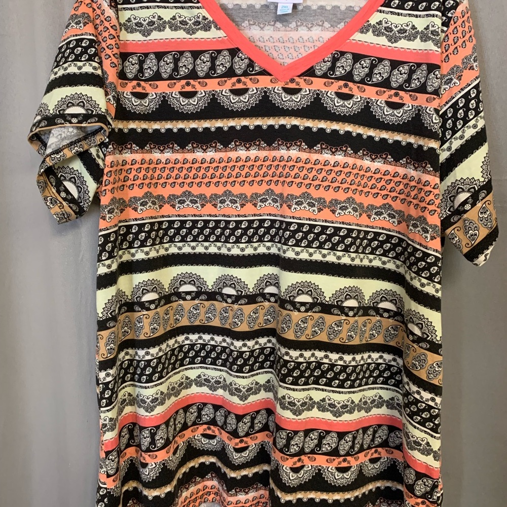 Group of 4 Lularoe tops.